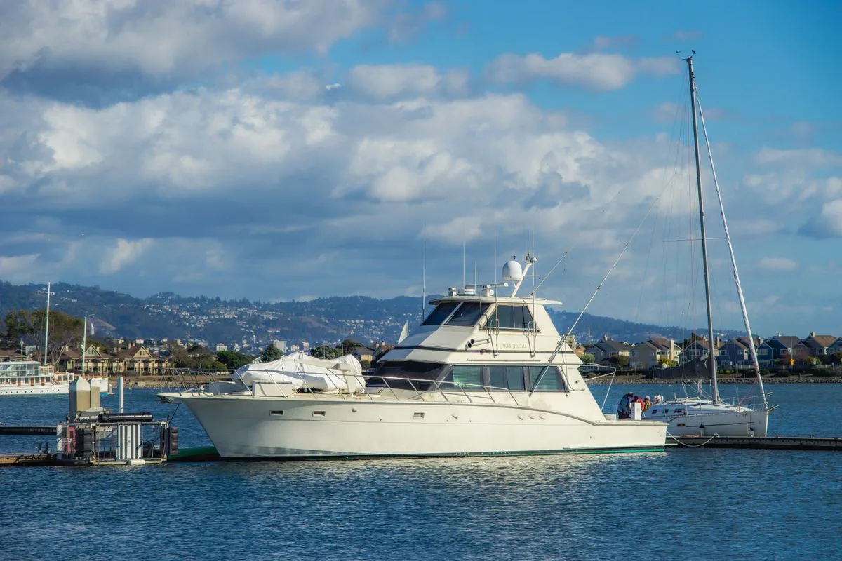 Flybridge motor yacht moored in a marina