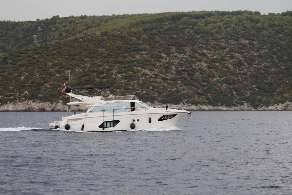 Motor yacht cruising along the coast