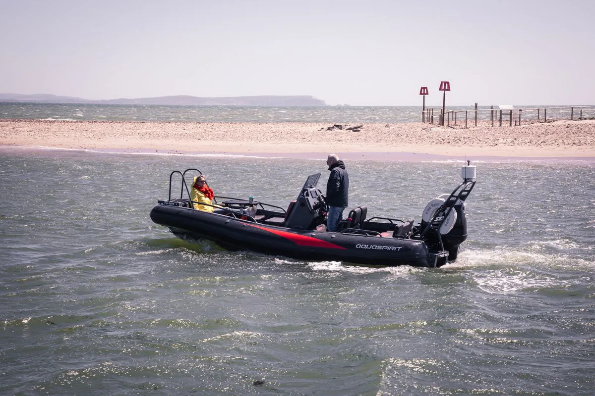 Rigid inflatable boat (RIB) running near the coast