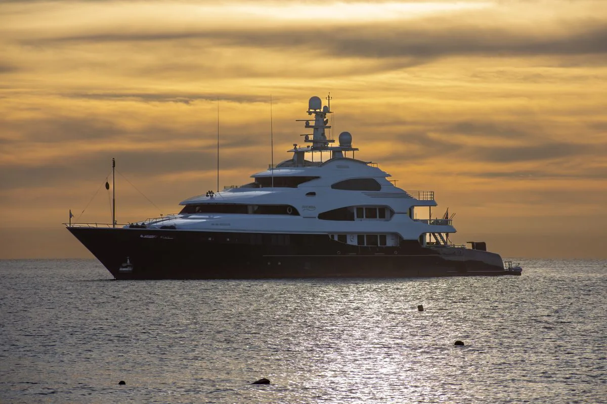Large superyacht at sunset